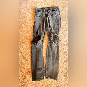 old pain of ripped black pants